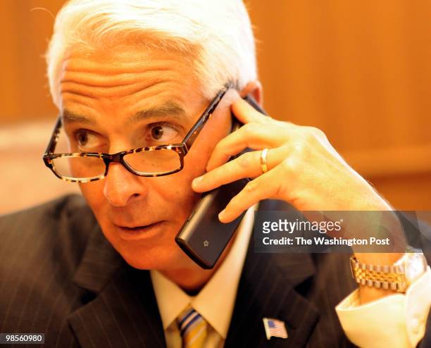 Florida Governor Charlie Crist speaks to education experts on the telephone concerning his decision to veto or not veto a bill to suspend tenure...