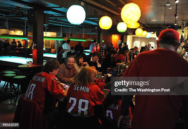 Long-time fans of DC's hockey team, the Washington Capitals, gather at the Rocket Bar near the Verizon Center before one of the final games of the...