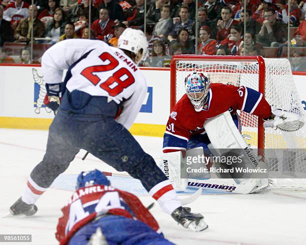 Carey Price of the Montreal Canadiens gets down to stop the puck on a shot by Alexander Semin of the Washington Capitals in Game Three of the Eastern...
