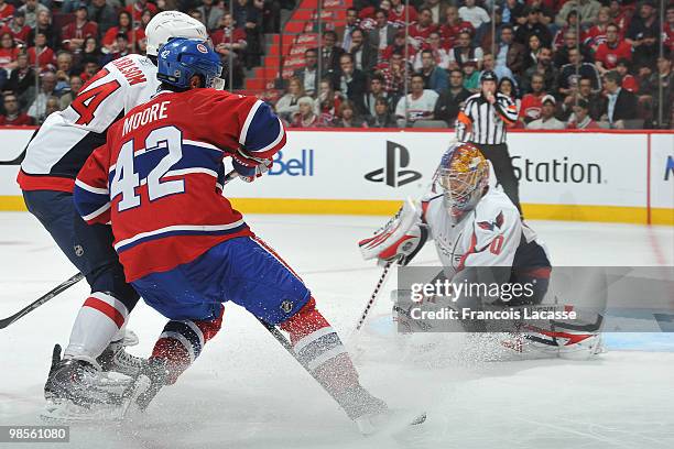 Semyon Varlamov of the Washington Capitals blocks a shot of Dominic Moore of the Montreal Canadiens in the Game Three of the Eastern Conference...