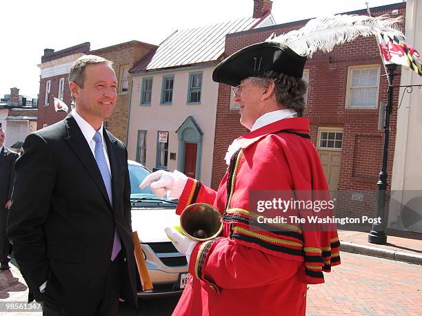 Governor Martin O'Malley stops to chat with Fred Taylor "Squire Frederick," the Annapolis Town Crier on the street near the Maryland State House....