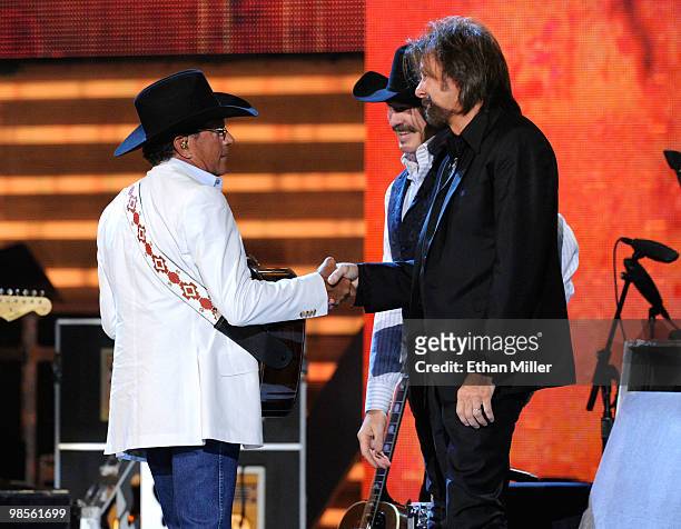 Musicians George Strait onstage with Kix Brooks and Ronnie Dunn of the band Brooks & Dunn during Brooks & Dunn's The Last Rodeo Show at MGM Grand...