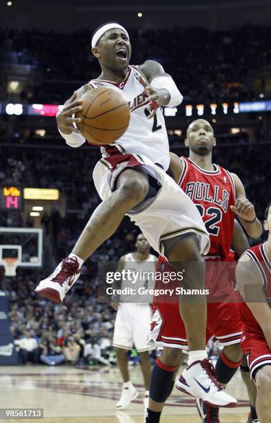 Mo Williams of the Cleveland Cavaliers tries to get a shot off in front of Taj Gibson of the Chicago Bulls in Game Two of the Eastern Conference...