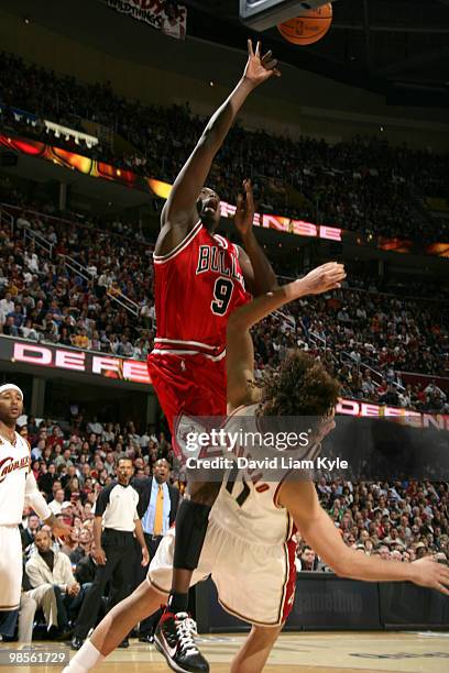 Luol Deng of the Chicago Bulls puts up the shot and draws the foul by Anderson Varejao of the Cleveland Cavaliers in Game Two of the Eastern...