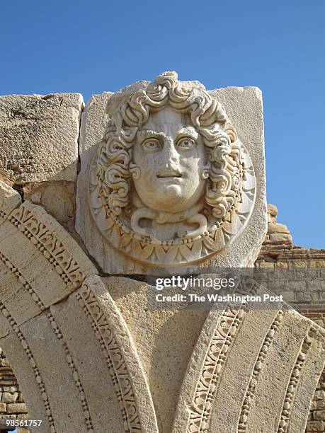 Handful of visitors inside the unspoiled ruins of Leptis Magna, an ancient Roman city in Libya edged against the azure waters of the Mediterranean....