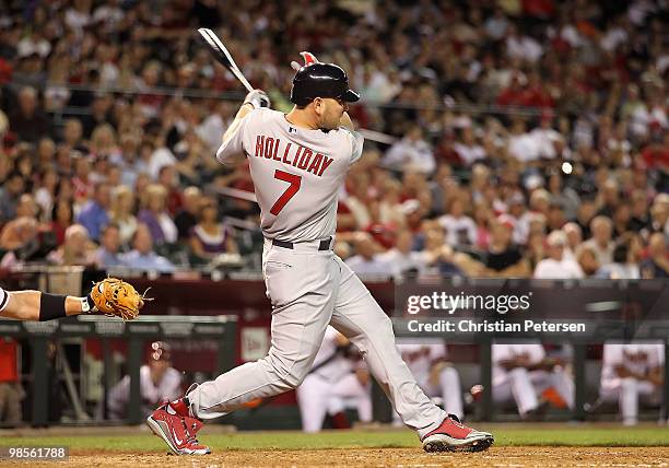 Matt Holliday of the St. Louis Cardinals hits a 2 run home run against the Arizona Diamondbacks during the fifth inning of the Major League Baseball...