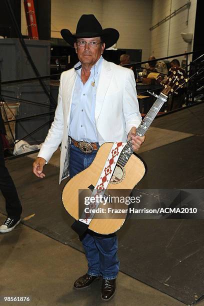 Musician George Strait poses backstage during Brooks & Dunn's The Last Rodeo Show at the MGM Grand Garden Arena on April 19, 2010 in Las Vegas,...