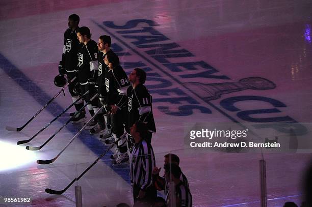 Wayne Simmonds, Drew Doughty, Rob Scuderi, Ryan Smyth and Anze Kopitar of the Los Angeles Kings stand on the ice prior to taking on the Vancouver...