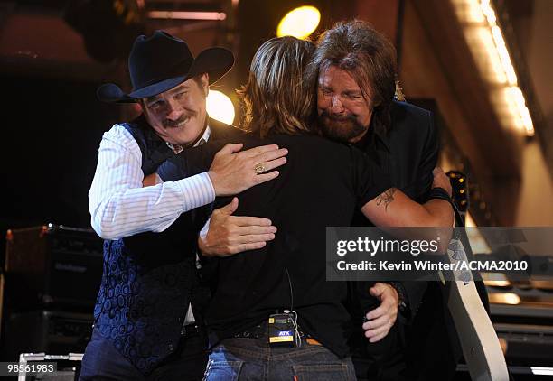 Musicians Kix Brooks and Ronnie Dunn of the band Brooks & Dunn with singer Faith Hill onstage during Brooks & Dunn's The Last Rodeo Show at MGM Grand...