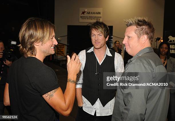 Musician Keith Urban with Joe Don Rooney and Gary LeVox of Rascal Flatts backstage during Brooks & Dunn's The Last Rodeo Show at the MGM Grand Garden...