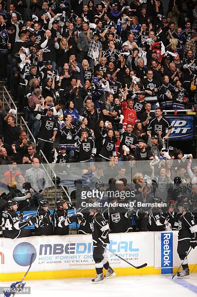 Anze Kopitar and Drew Doughty of the Los Angeles Kings celebrate with the bench after a goal against the Vancouver Canucks in Game Three of the...