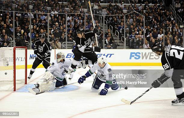 Michal Handzus of the Los Angeles Kings scores a goal past Roberto Luongo of the Vancouver Canucks as Ryan Smyth of the Los Angeles Kings and Shane...