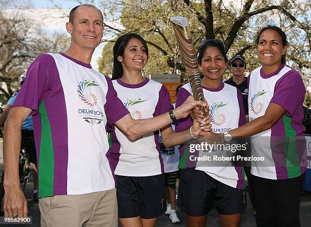 Steve Moneghetti and Cathy Freeman receive the baton from Chandhi Dhingra and Sonia Brito as part of the Delhi 2010 Commonwealth Games Queen's Baton...