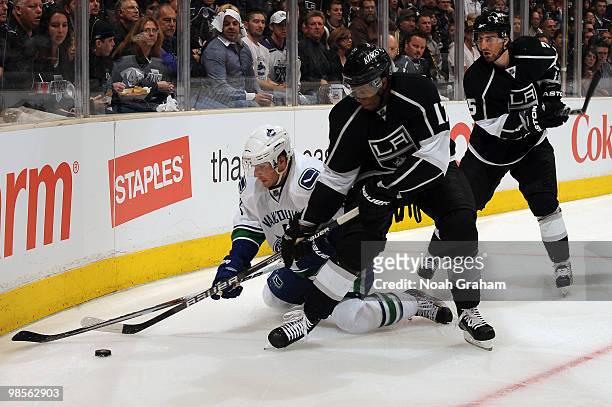 Wayne Simmonds of the Los Angeles Kings battles for the puck against Steve Bernier of the Vancouver Canucks in Game Three of the Western Conference...