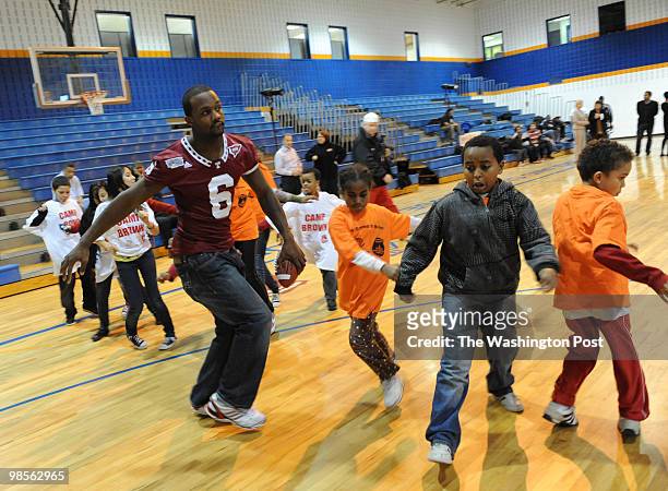 December 28: Temple players, including Dominique Harris, a 2005 H.D. Woodson graduate and Temple captain, participate in a clinic as part of the...