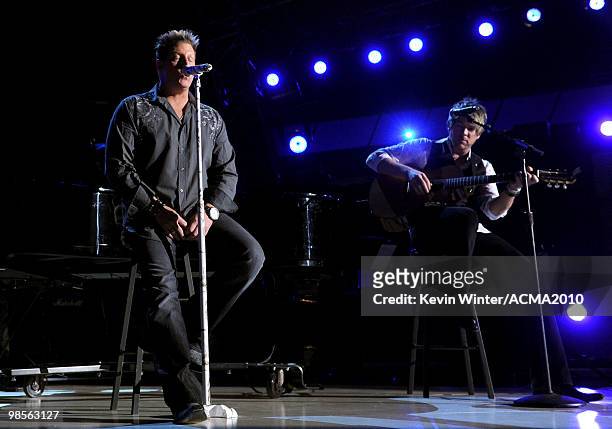 Musician Gary LeVox and Joe Don Rooney of the band Rascal Flatts perform onstage during Brooks & Dunn's The Last Rodeo Show at the MGM Grand Garden...