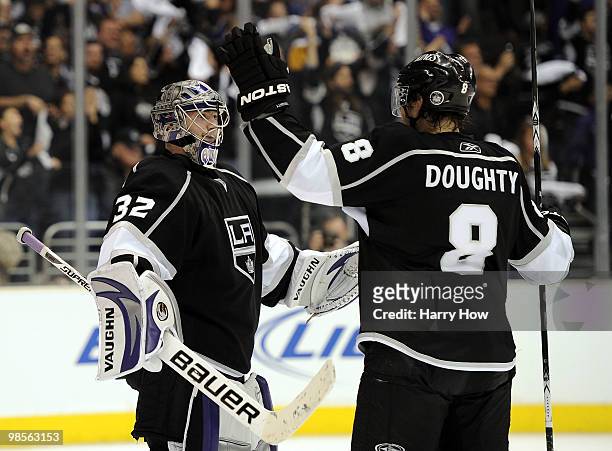 Jonathan Quick of the Los Angeles Kings celebrates a 5-3 victory with Drew Doughty over the Vancouver Canucks in game three of the Western Conference...
