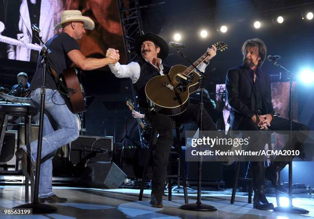 Musicians Kenny Chesney, Kix Brooks and Ronnie Dunn of the band Brooks & Dunn perform onstage during Brooks & Dunn's The Last Rodeo Show at MGM Grand...