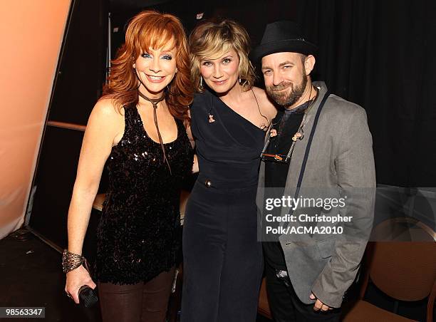 Singer Reba McEntire and musicians Jennifer Nettles and Kristian Bush of the band Sugarland pose backstage during Brooks & Dunn's The Last Rodeo Show...