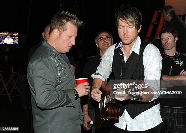 Musicians Gary LeVox and Joe Don Rooney of Rascal Flatts prepare backstage during Brooks & Dunn's The Last Rodeo Show at the MGM Grand Garden Arena...