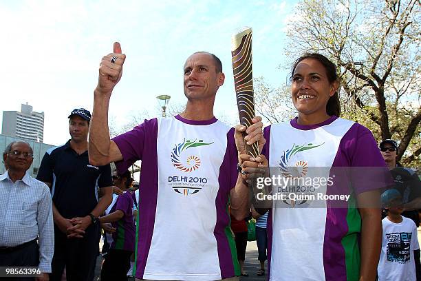 Steve Moneghetti and Cathy Freeman pose with the baton as part of the Delhi 2010 Commonwealth Games Queen's Baton relay at Federation Square on April...