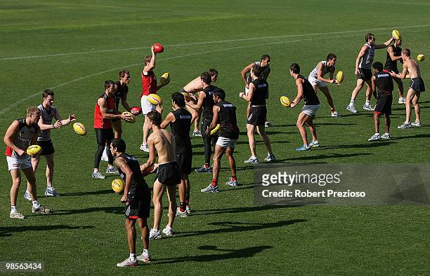 Players do handball drills during an Essendon Bombers AFL training session at Windy Hill on April 20, 2010 in Melbourne, Australia.