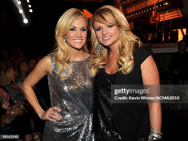 Singer Carrie Underwood and musician Miranda Lambert pose in the audience during Brooks & Dunn's The Last Rodeo Show at MGM Grand Garden Arena on...