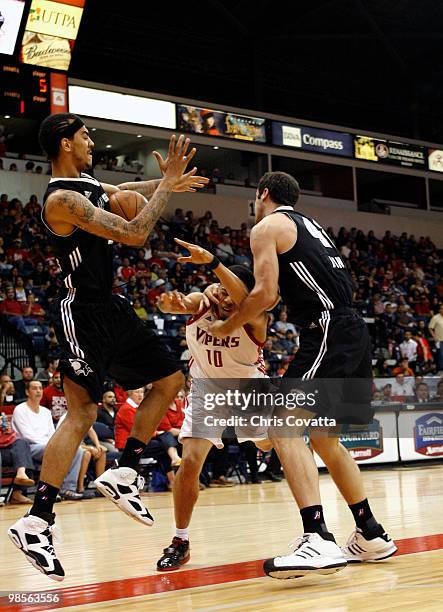 Luke Bonner of the Austin Toros intentionally fouls Jonathan Wallace of the Rio Grande Valley Vipers while Marcus Williams of the Austin Toros grabs...