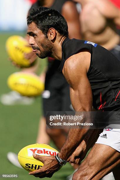 Nathan Lovett-Murray handballs during an Essendon Bombers AFL training session at Windy Hill on April 20, 2010 in Melbourne, Australia.