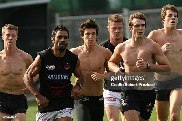 Nathan Lovett-Murray runs with team-mates during an Essendon Bombers AFL training session at Windy Hill on April 20, 2010 in Melbourne, Australia.