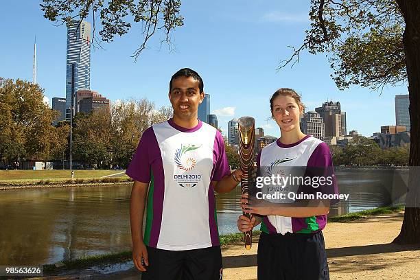 Rohit Kumar and Australian gymnast Emma Denis carry the baton as part of the Delhi 2010 Commonwealth Games Queen's Baton relay at Birrarung Marr on...