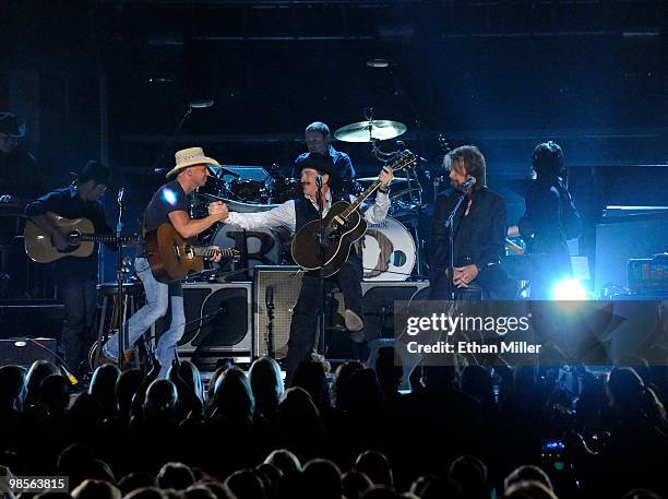 Musician Kenny Chesney with musicians Kix Brooks and Ronnie Dunn performs onstage during Brooks & Dunn's The Last Rodeo Show at MGM Grand Garden...