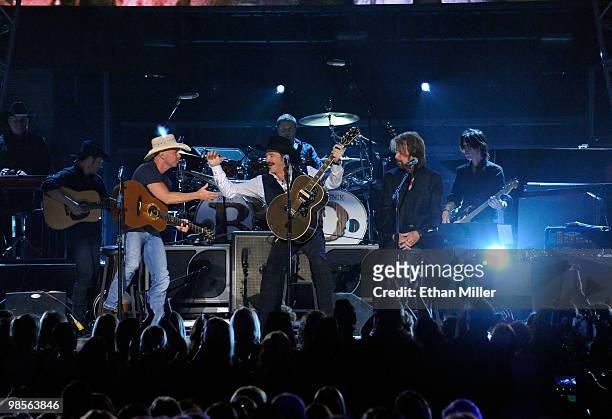 Musician Kenny Chesney with musicians Kix Brooks and Ronnie Dunn performs onstage during Brooks & Dunn's The Last Rodeo Show at MGM Grand Garden...