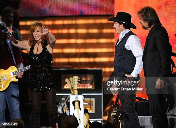 Singer Reba McEntire with musicians Kix Brooks and Ronnie Dunn of Brooks & Dunn onstage during Brooks & Dunn's The Last Rodeo Show at MGM Grand...