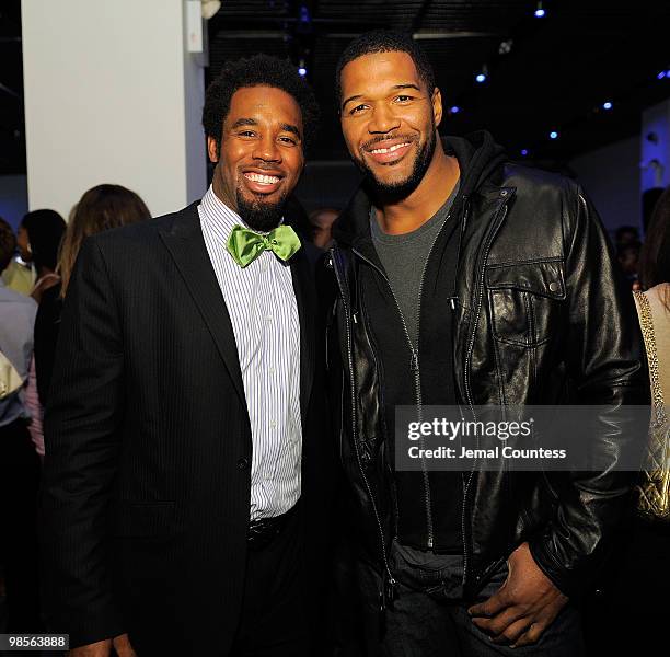 Professional Football Player Dhani Jones and former NFL playerMichael Strahan attend the exclusive viewing party for "Dhani Tackles The Globe" at Red...