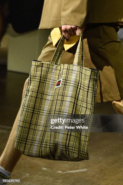 Model, bag detail, walks the runway during the Kenzo Menswear Spring/Summer 2019 show as part of Paris Fashion Week on June 24, 2018 in Paris, France.