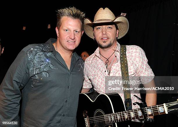 Musician Gary LeVox of the band Rascal Flatts and Jason Aldean pose backstage during Brooks & Dunn's The Last Rodeo Show at the MGM Grand Garden...