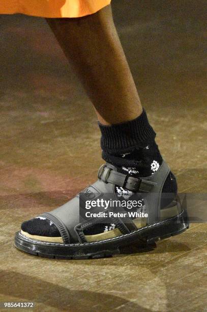 Model, shoes detail, walks the runway during the Kenzo Menswear Spring/Summer 2019 show as part of Paris Fashion Week on June 24, 2018 in Paris,...