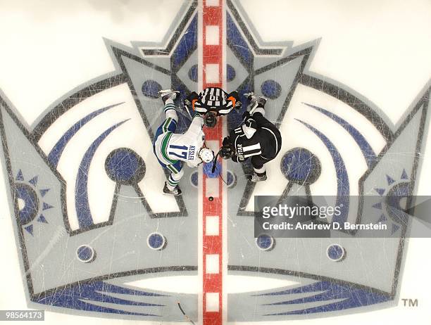 Ryan Kesler of the Vancouver Canucks takes the opening faceoff against Anze Kopitar of the Los Angeles Kings in Game Three of the Western Conference...