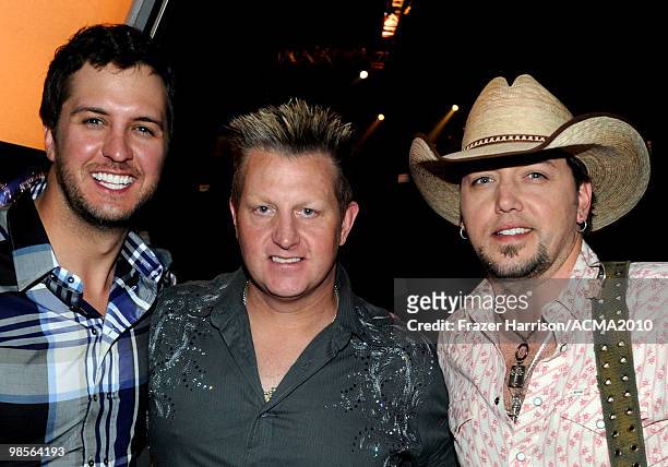 Musicians Luke Bryan, Gary LeVox of the band Rascal Flatts and Jason Aldean pose backstage during Brooks & Dunn's The Last Rodeo Show at the MGM...