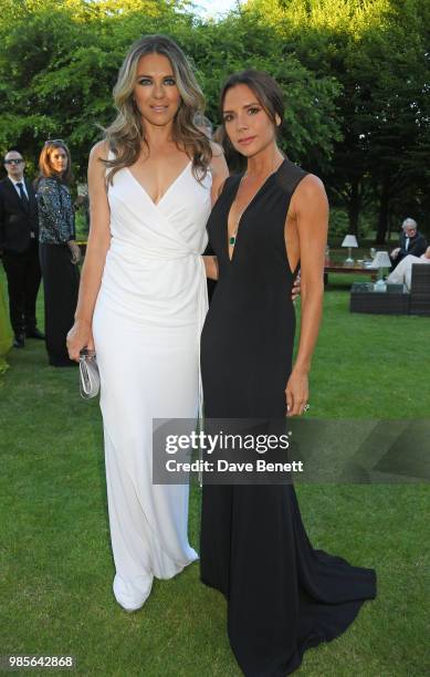 Elizabeth Hurley and Victoria Beckham attend the Argento Ball for the Elton John AIDS Foundation in association with BVLGARI & Bob and Tamar...