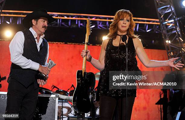 Musician Reba McEntire presents the ACM Milestone Award to Kix Brooks of the band Brooks & Dunn onstage during Brooks & Dunn's The Last Rodeo Show at...