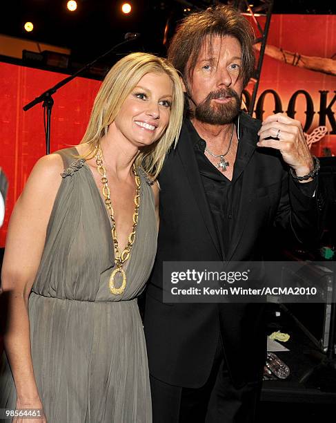 Singer Faith Hill and musician Ronnie Dunn of the band Brooks & Dunn pose in the audience during Brooks & Dunn's The Last Rodeo Show at MGM Grand...