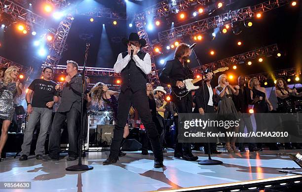 Musicians Kix Brooks and Ronnie Dunn of the band Brooks & Dunn perform onstage with musicians Carrie Underwood, Jay DeMarcus, Gary LeVox, Taylor...