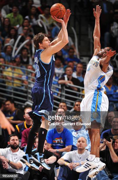 Kyle Korver of the Utah Jazz takes a shot against Aaron Afflalo of the Denver Nuggets in Game Two of the Western Conference Quarterfinals during the...