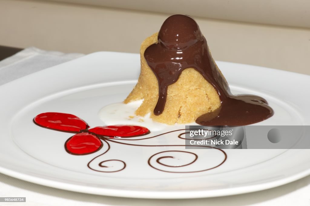 Semolina halva with red flower and cream