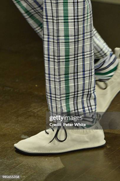 Model, shoes detail, walks the runway during the Kenzo Menswear Spring/Summer 2019 show as part of Paris Fashion Week on June 24, 2018 in Paris,...