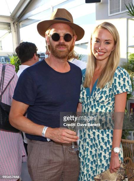 Alistair Guy and Noelle Reno attend the Perrier Jouet VIP reception on the Perrier Jouet Champagne Terrace at Masterpiece London at the Royal...