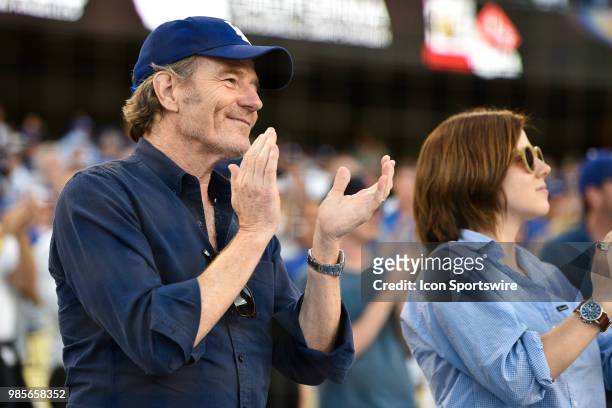 Actor Bryan Cranston and daughter cheer during a MLB game between the Chicago Cubs and the Los Angeles Dodgers on June 26, 2018 at Dodger Stadium in...
