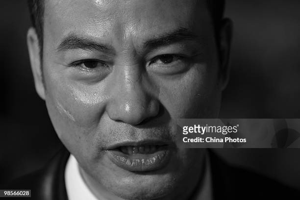 Hong Kong actor Simon Yam speaks to media on the red carpet during the 29th Hong Kong Film Awards Presentation Ceremony on April 18, 2010 in HONG...